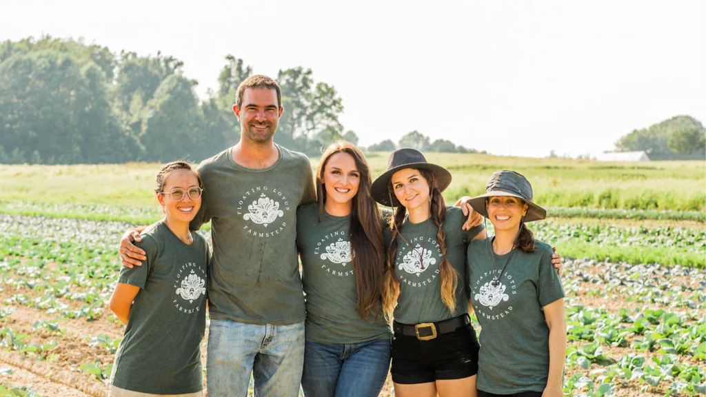 Five person crew smiling on their farm