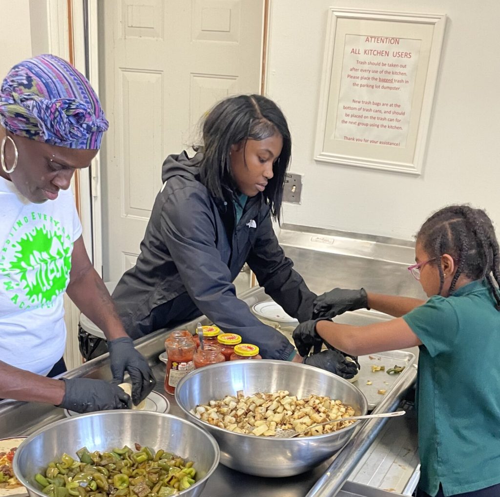 Burrito filling teamwork.