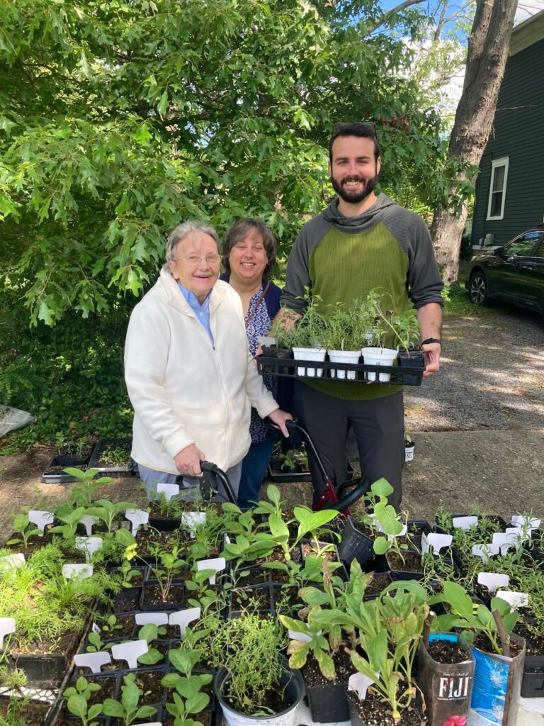 Neighbors at a Joy Grows plant sale in 2024