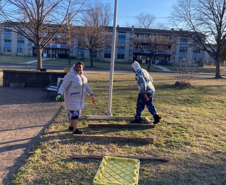 Pantha and Ms. Peaches laying out the first beds at the Healing Garden