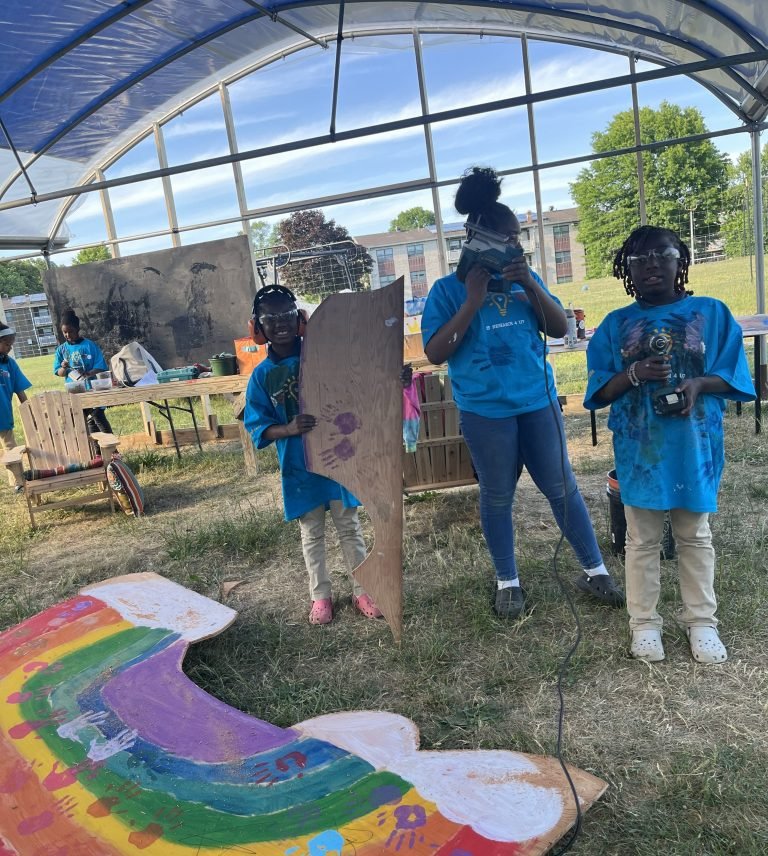 Art Club making painted shapes in the greenhouse