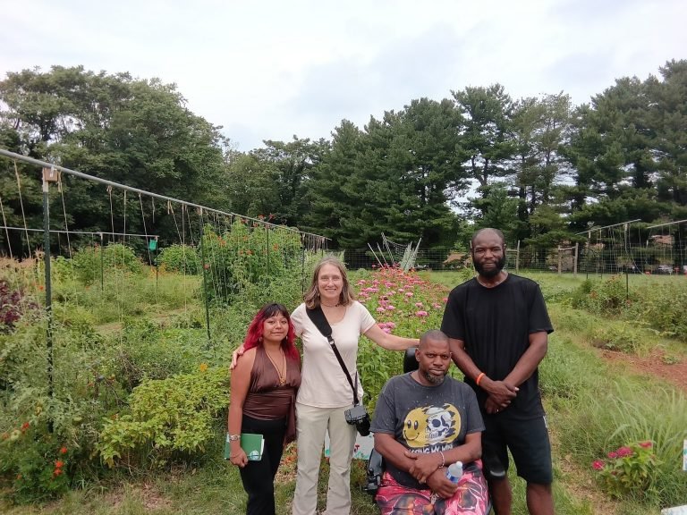 Native plant speaker Allison Milligan with Yessenia, Kareem and Randy in the garden