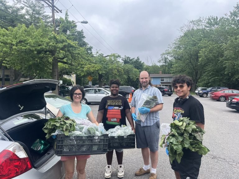 Damari delivering farm vegetables to the food pantry at St. Luke's