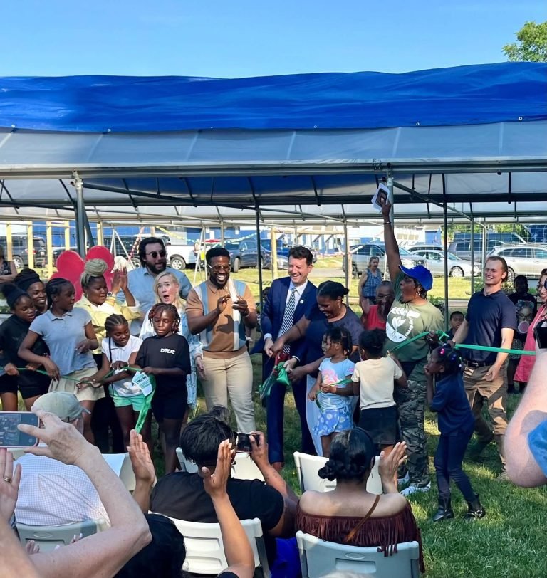 The mayor and Pantha cutting the ribbon at Eastport Community Farm