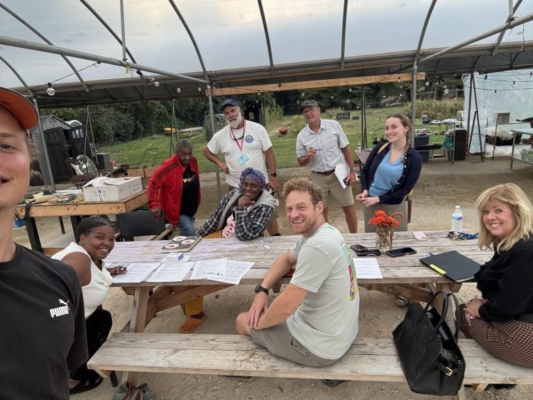 Joy Grows board members and team after a board meeting at the greenhouse